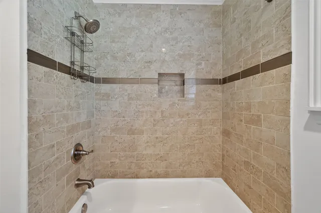 a bathroom with a granite countertop toilet sink and mirror