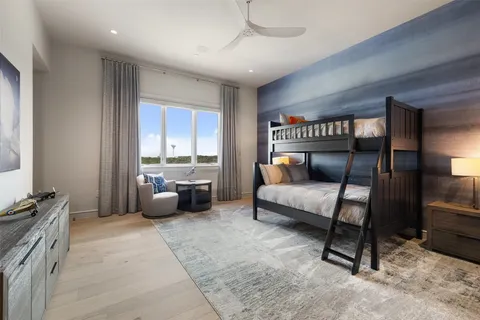 a bedroom with furniture and a window