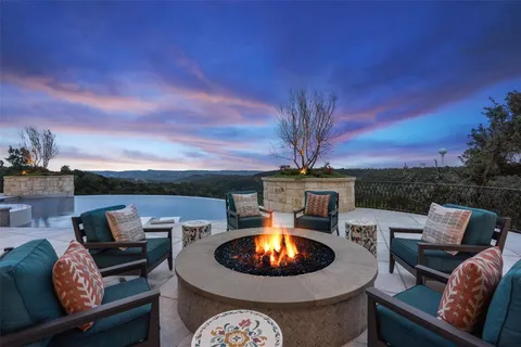 an outdoor space with furniture and fireplace