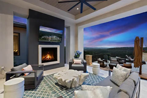 a living room with furniture fireplace and a flat screen tv