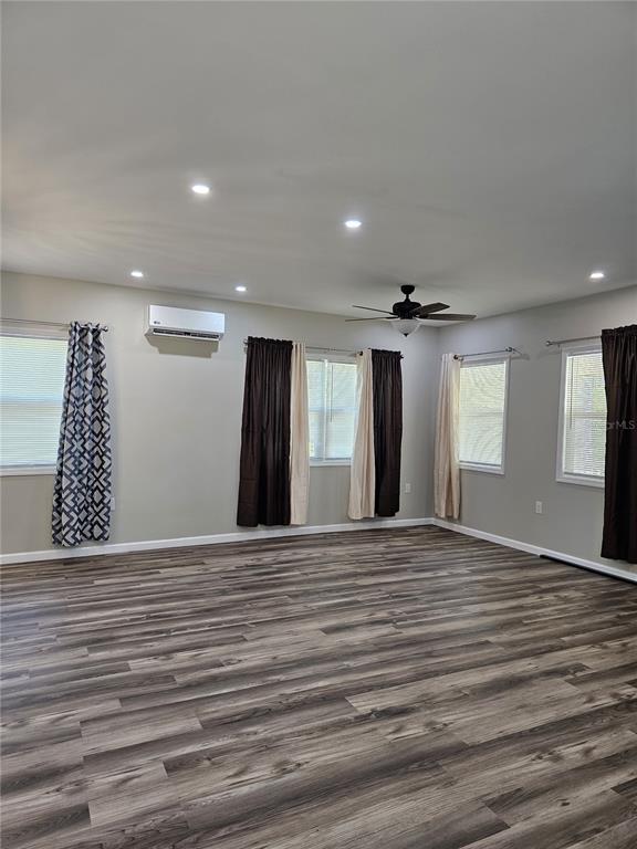 20805 Sheldon Street Orlando, FL 32833 - Photo 14 of 33 a view of an empty room with wooden floor and a window