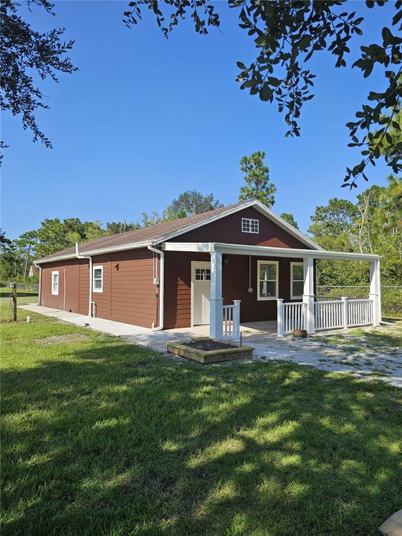 20805 Sheldon Street Orlando, FL 32833 - Photo 2 of 33 a front view of a house with a garden