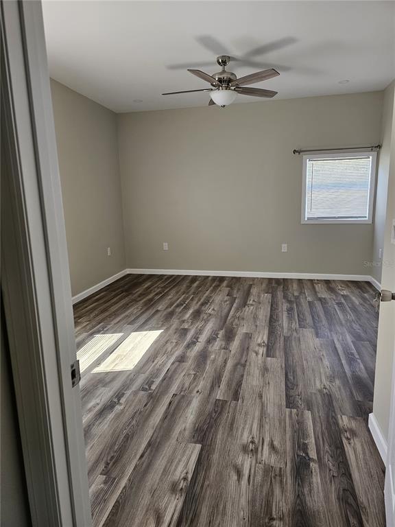 20805 Sheldon Street Orlando, FL 32833 - Photo 21 of 33 wooden floor in an empty room with a window