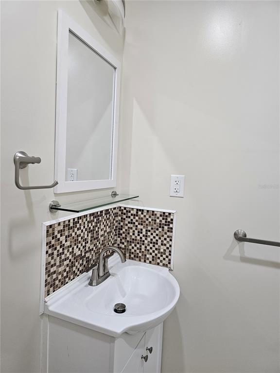 20805 Sheldon Street Orlando, FL 32833 - Photo 28 of 33 a bathroom with a sink and a mirror