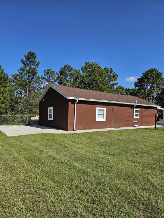 20805 Sheldon Street Orlando, FL 32833 - Photo 32 of 33 a view of a yard with an outdoor space