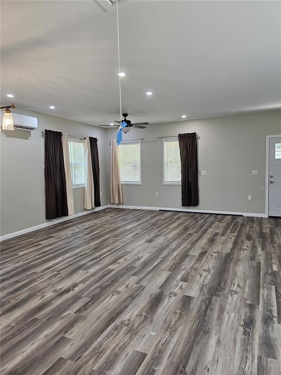 20805 Sheldon Street Orlando, FL 32833 - Photo 7 of 33 a view of a livingroom with a ceiling fan and wooden floor