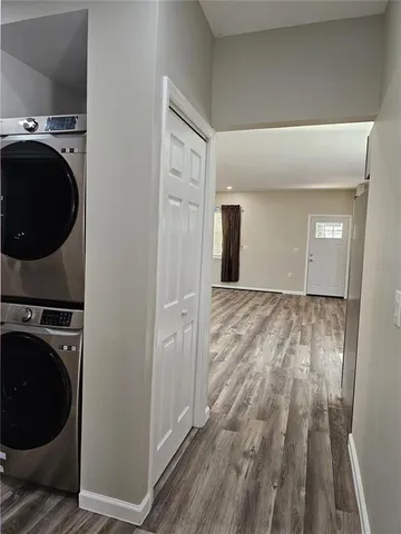 a view of a hallway with washer and dryer