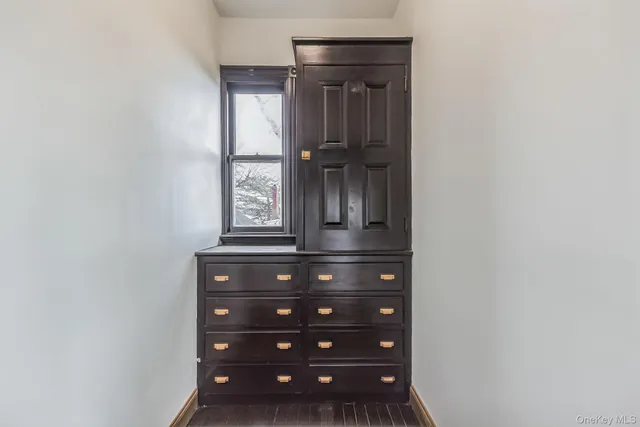 a view of an entryway with wooden floor