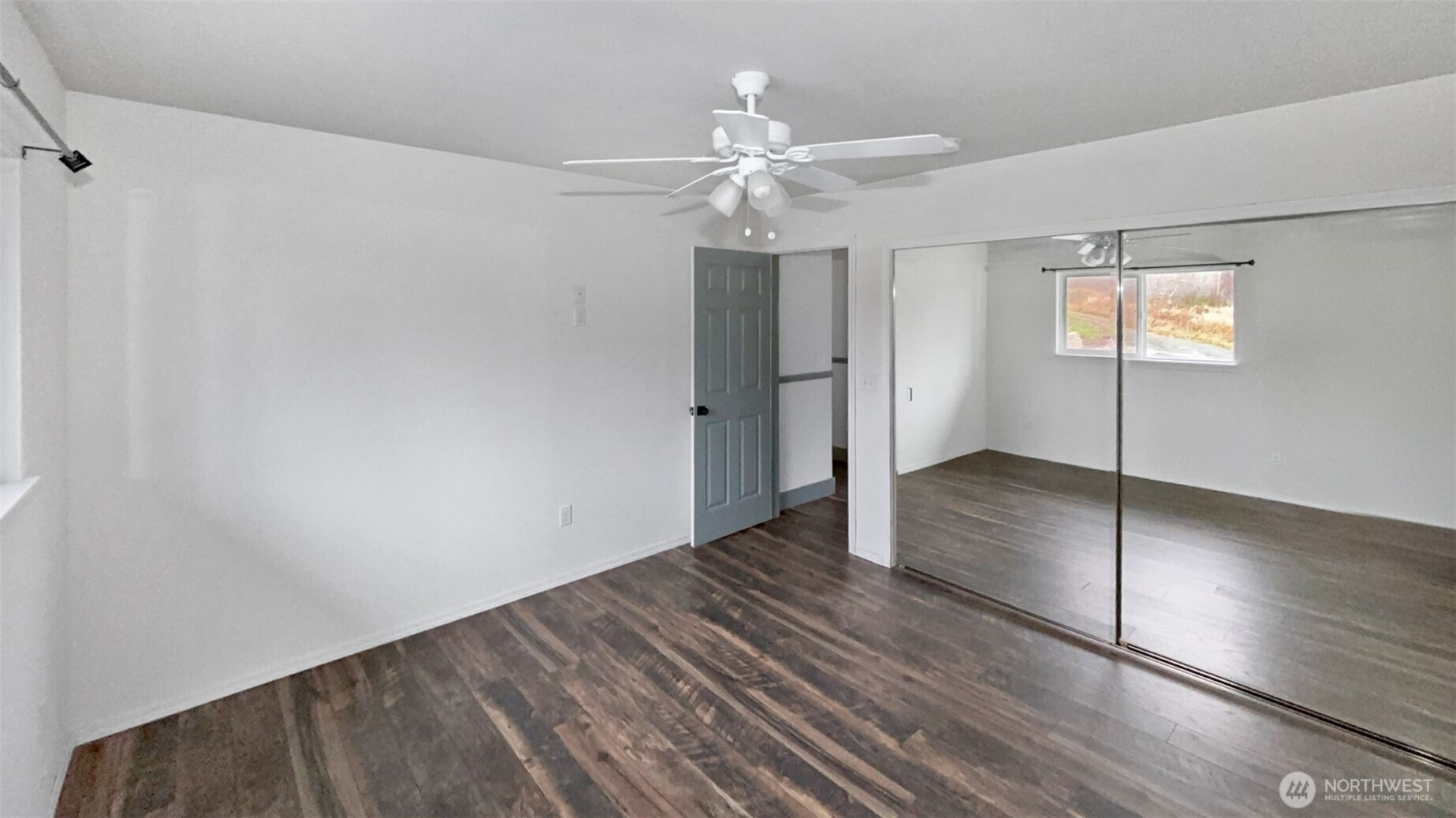 280 Devonshire Road Montesano, WA 98563 - Photo 12 of 20 wooden floor in an empty room with a window
