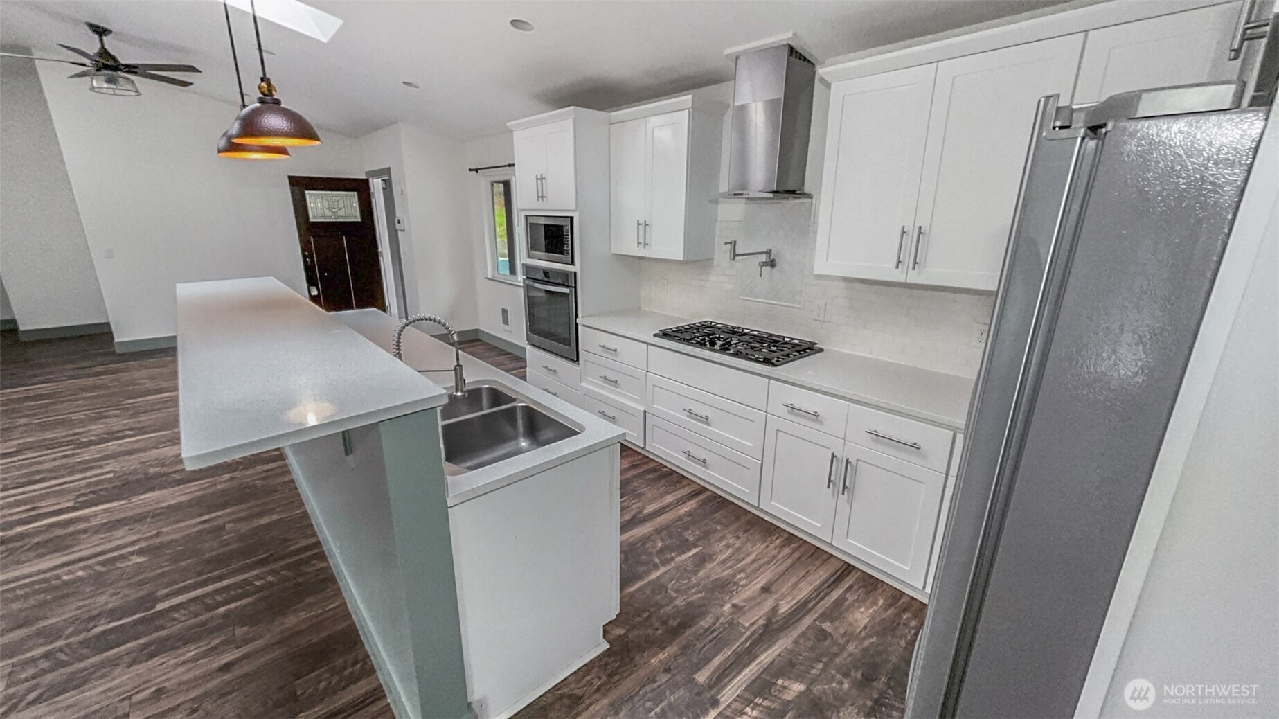 280 Devonshire Road Montesano, WA 98563 - Photo 17 of 20 a kitchen with white cabinets and stainless steel appliances