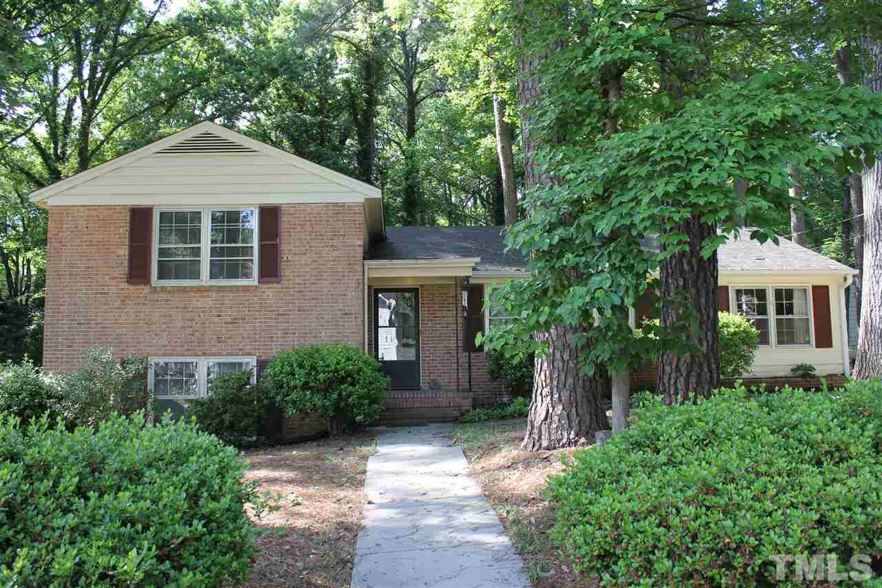 816 Macon Place Raleigh, NC 27609 - Photo 1 of 17 a front view of a house with a yard and trees