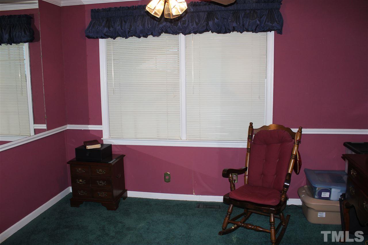 816 Macon Place Raleigh, NC 27609 - Photo 6 of 17 a bath room with a chair and a potted plant