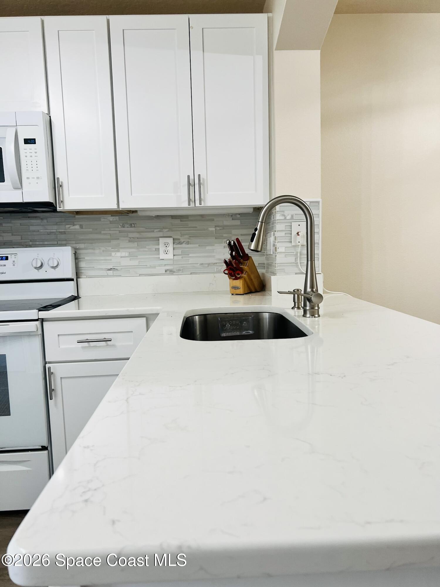 1145 Luminary Circle, Unit 104 Melbourne, FL 32901 - Photo 12 of 37 a close view of sink and tap