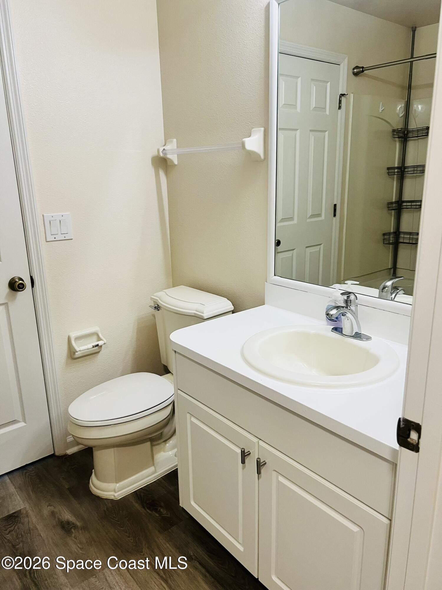 1145 Luminary Circle, Unit 104 Melbourne, FL 32901 - Photo 28 of 37 a bathroom with a sink toilet and shower