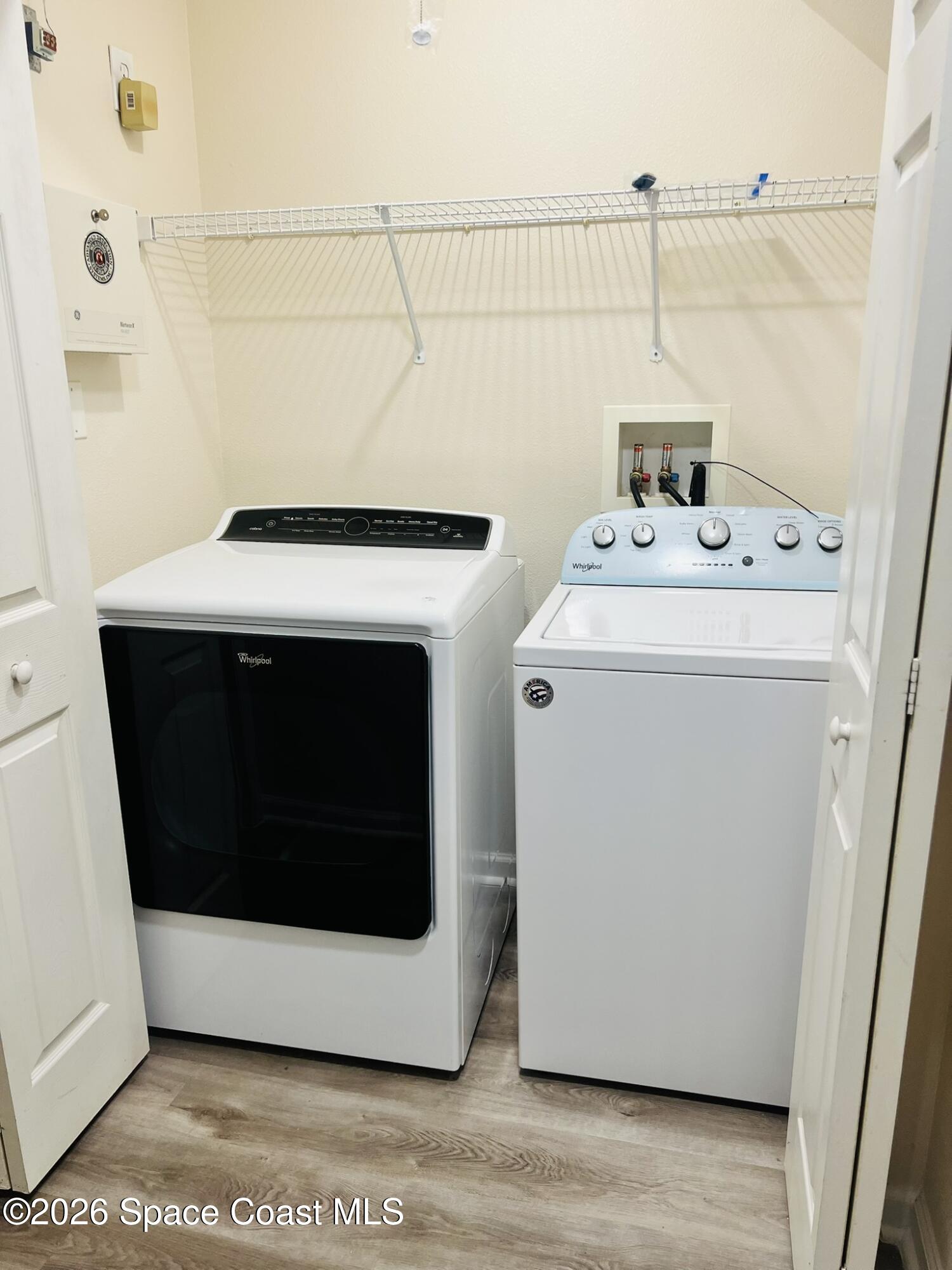 1145 Luminary Circle, Unit 104 Melbourne, FL 32901 - Photo 29 of 37 a utility room with a washer and dryer
