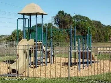 a view of a house with backyard and pool