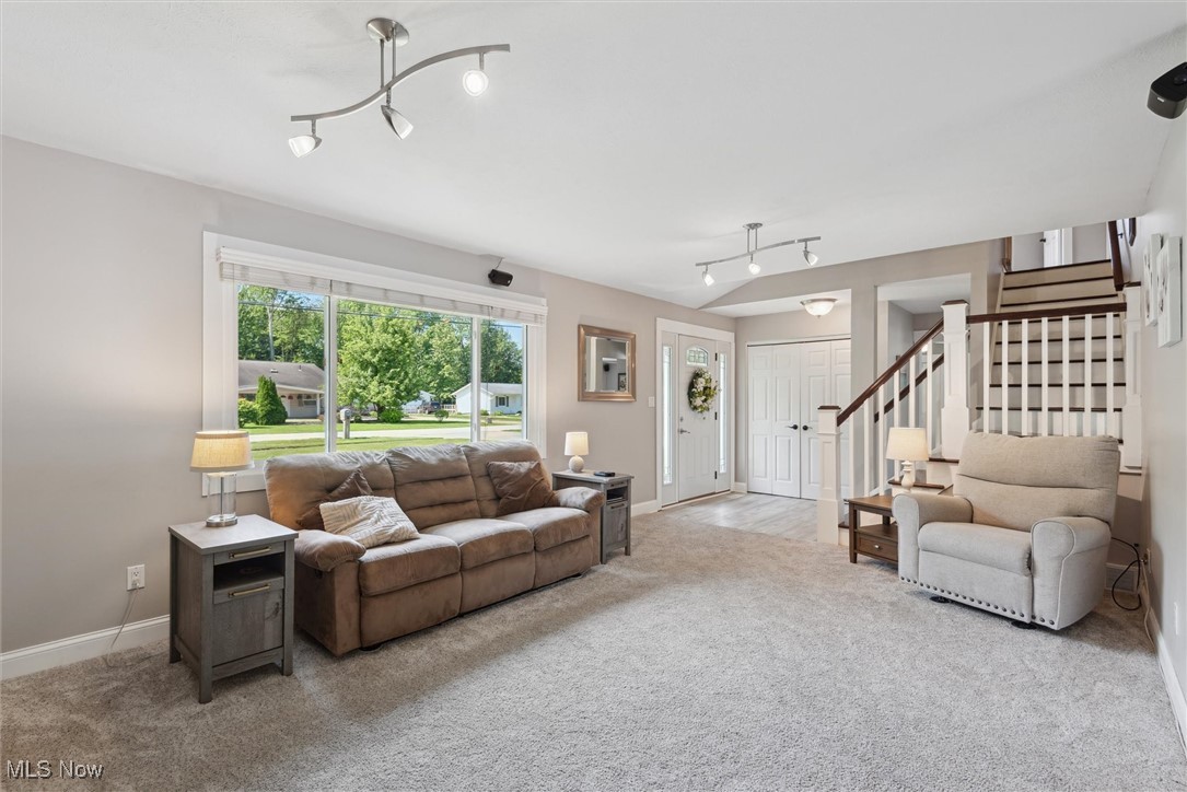 8191 Edgewood Road Mentor, OH 44060 - Photo 8 of 44 Bright and inviting living room with a stunning picture window that fills the space with natural light—perfect for relaxing or entertaining