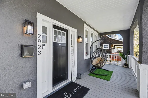 a view of an entryway with wooden floor
