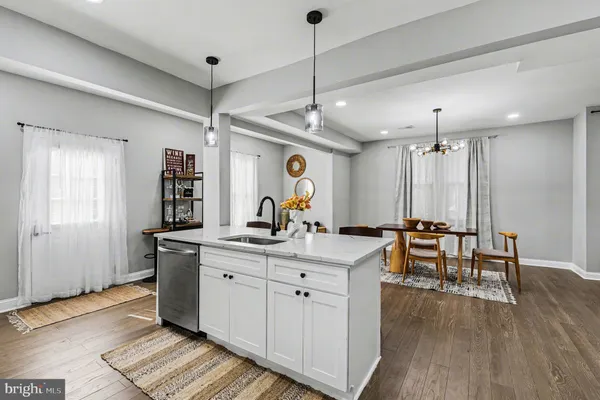 a view of a kitchen counter space with wooden floor
