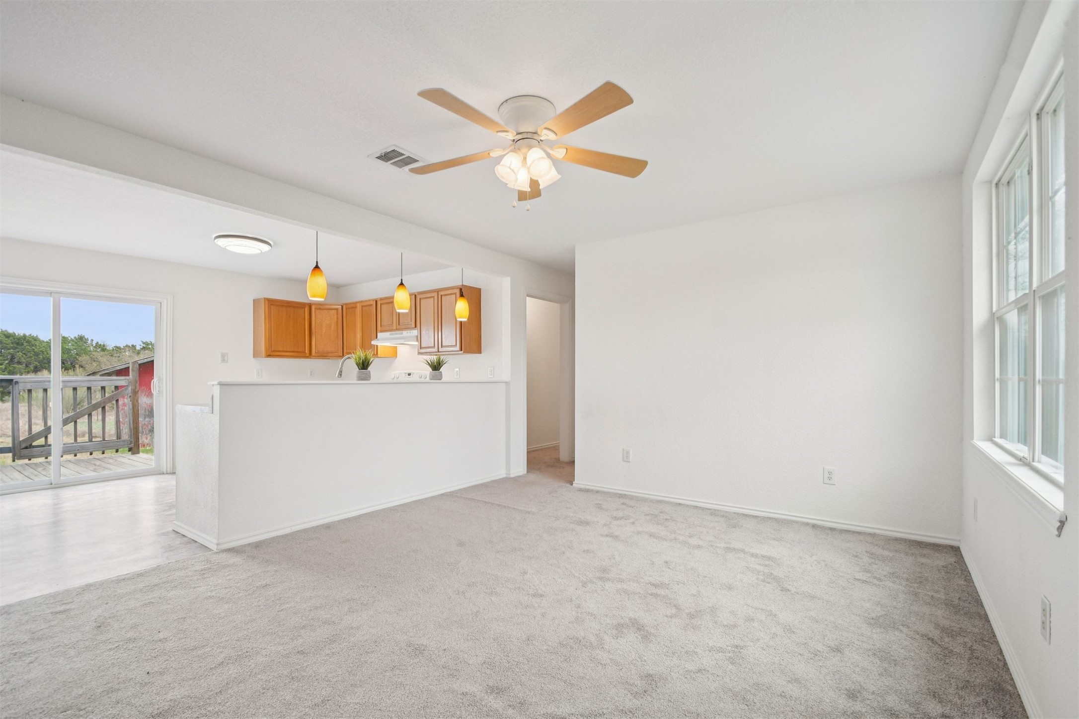 1470 Oak Grove Road Leander, TX 78641 - Photo 8 of 38 an empty room with fan and windows