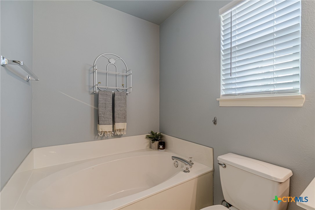 2369 Carson Loop New Braunfels, TX 78130 - Photo 13 of 28 a bathroom with a bathtub