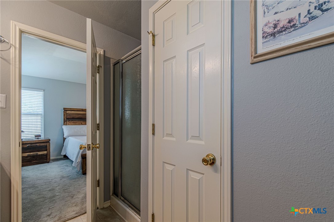 2369 Carson Loop New Braunfels, TX 78130 - Photo 14 of 28 a view of a hallway with closet and a bathroom