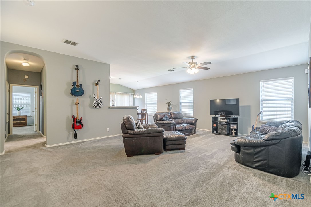 2369 Carson Loop New Braunfels, TX 78130 - Photo 3 of 28 a living room with furniture and a flat screen tv