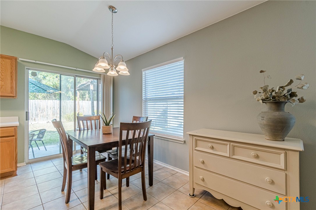2369 Carson Loop New Braunfels, TX 78130 - Photo 8 of 28 a dining room with furniture and window