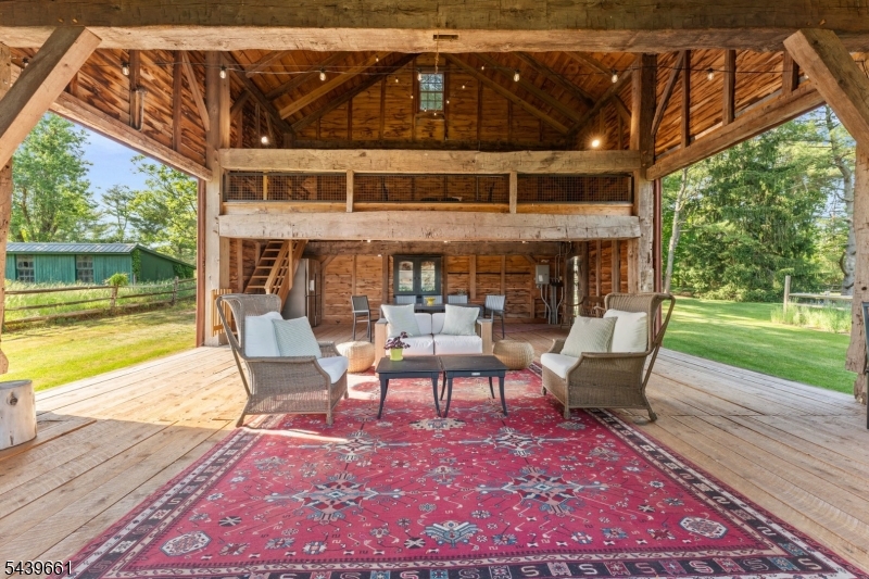 29 Bedens Brook Road Skillman, NJ 08558 - Photo 47 of 50 a view of a patio with table and chairs floor to ceiling window with yard and a barbeque