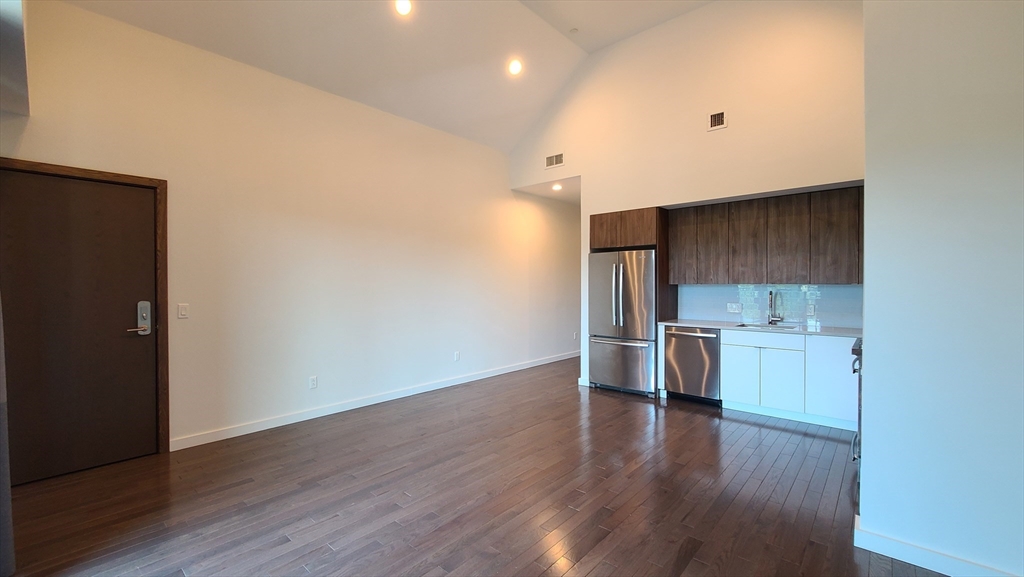 143-171 Hyde Park Avenue, Unit 163B Boston, MA 02130 - Photo 11 of 24 a view of a kitchen with a sink and a stove top oven