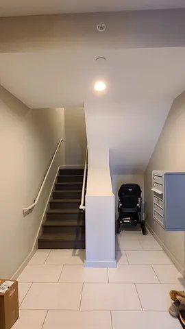 a living room with furniture and a piano