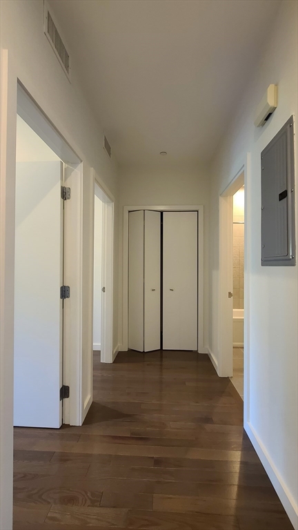 143-171 Hyde Park Avenue, Unit 163B Boston, MA 02130 - Photo 6 of 24 a view of an empty room with wooden floor