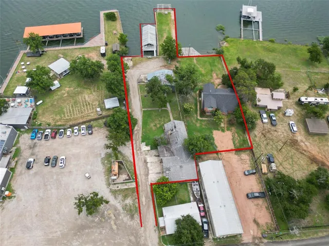 an aerial view of a house with outdoor space