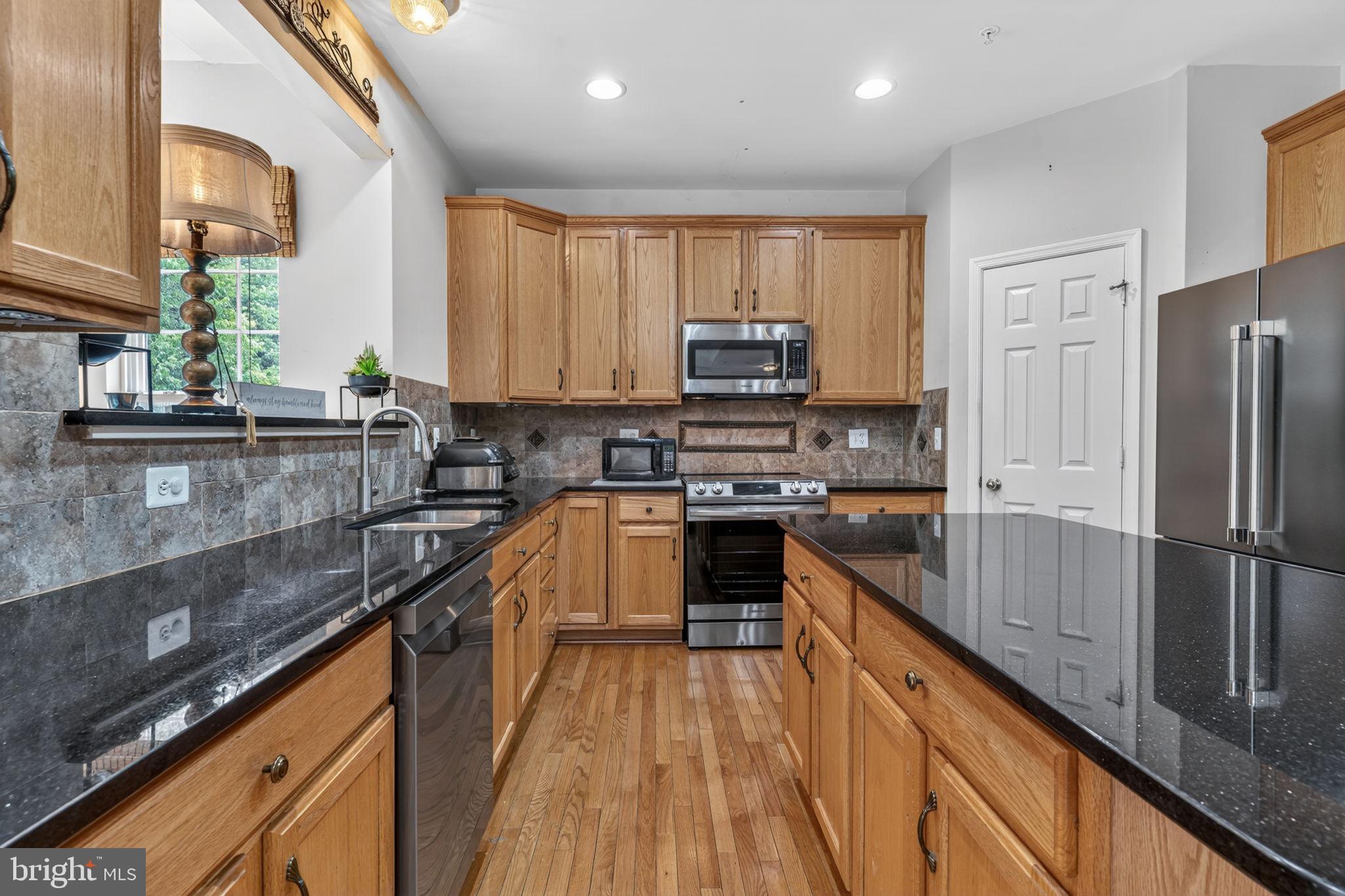 1200 Strausberg Street Accokeek, MD 20607 - Photo 6 of 47 Renovated Kitchen w/ granite tops & SS appliances