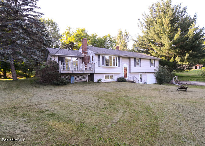 3759 Hancock Road Hancock, MA 01237 - Photo 2 of 30 a view of a house with a yard and large trees