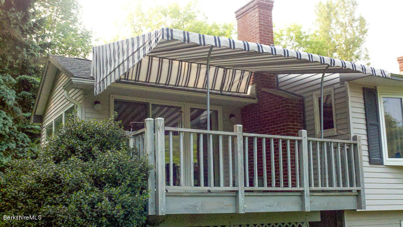 3759 Hancock Road Hancock, MA 01237 - Photo 12 of 30 a view of a house with a deck and furniture