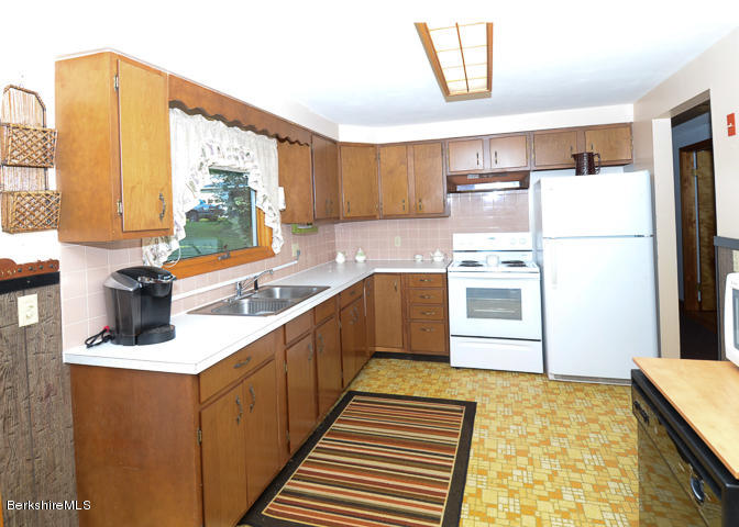 3759 Hancock Road Hancock, MA 01237 - Photo 13 of 30 a kitchen with a refrigerator and a sink
