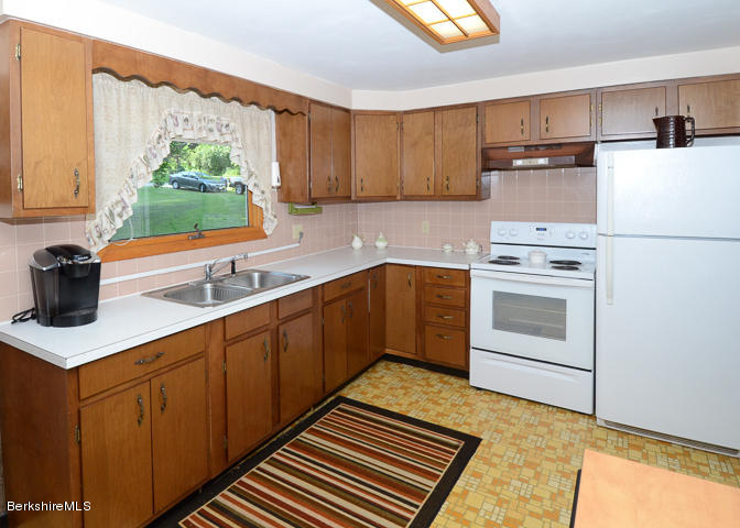 3759 Hancock Road Hancock, MA 01237 - Photo 15 of 30 a kitchen with a sink stove and microwave