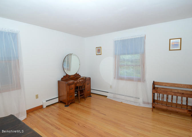 3759 Hancock Road Hancock, MA 01237 - Photo 19 of 30 a room with wooden floor and a window