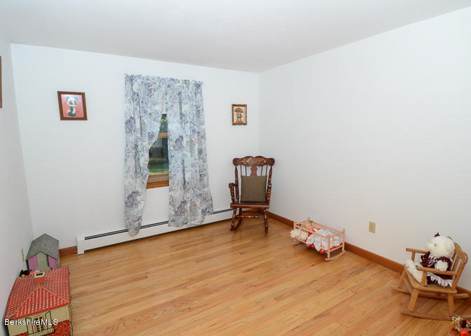 3759 Hancock Road Hancock, MA 01237 - Photo 21 of 30 a view of a room with wooden floor and a window