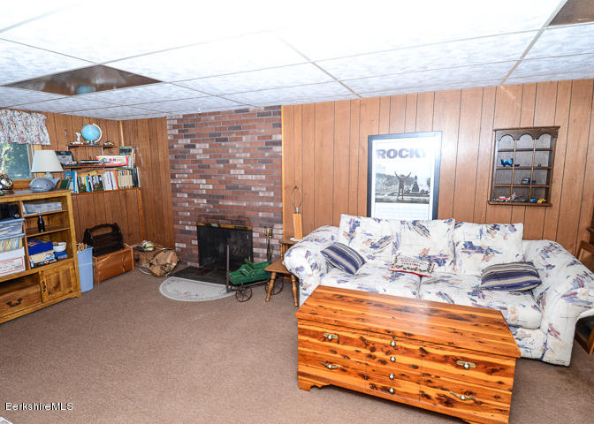 3759 Hancock Road Hancock, MA 01237 - Photo 24 of 30 a bedroom with furniture and a fireplace