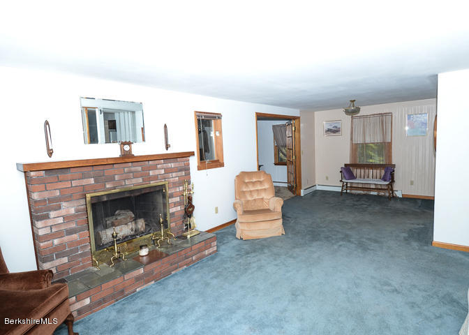 3759 Hancock Road Hancock, MA 01237 - Photo 6 of 30 a living room with furniture and a fireplace