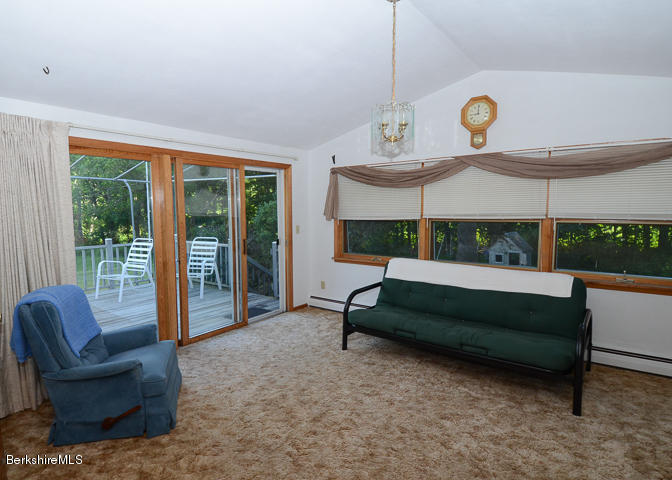 3759 Hancock Road Hancock, MA 01237 - Photo 7 of 30 a bedroom with a bed and a large window