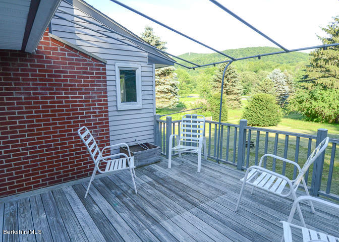 3759 Hancock Road Hancock, MA 01237 - Photo 10 of 30 a view of a chair in wooden deck