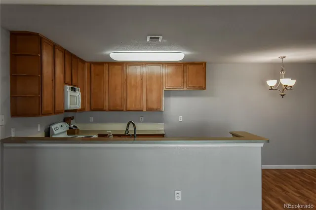 a room with a sink cabinets and utility