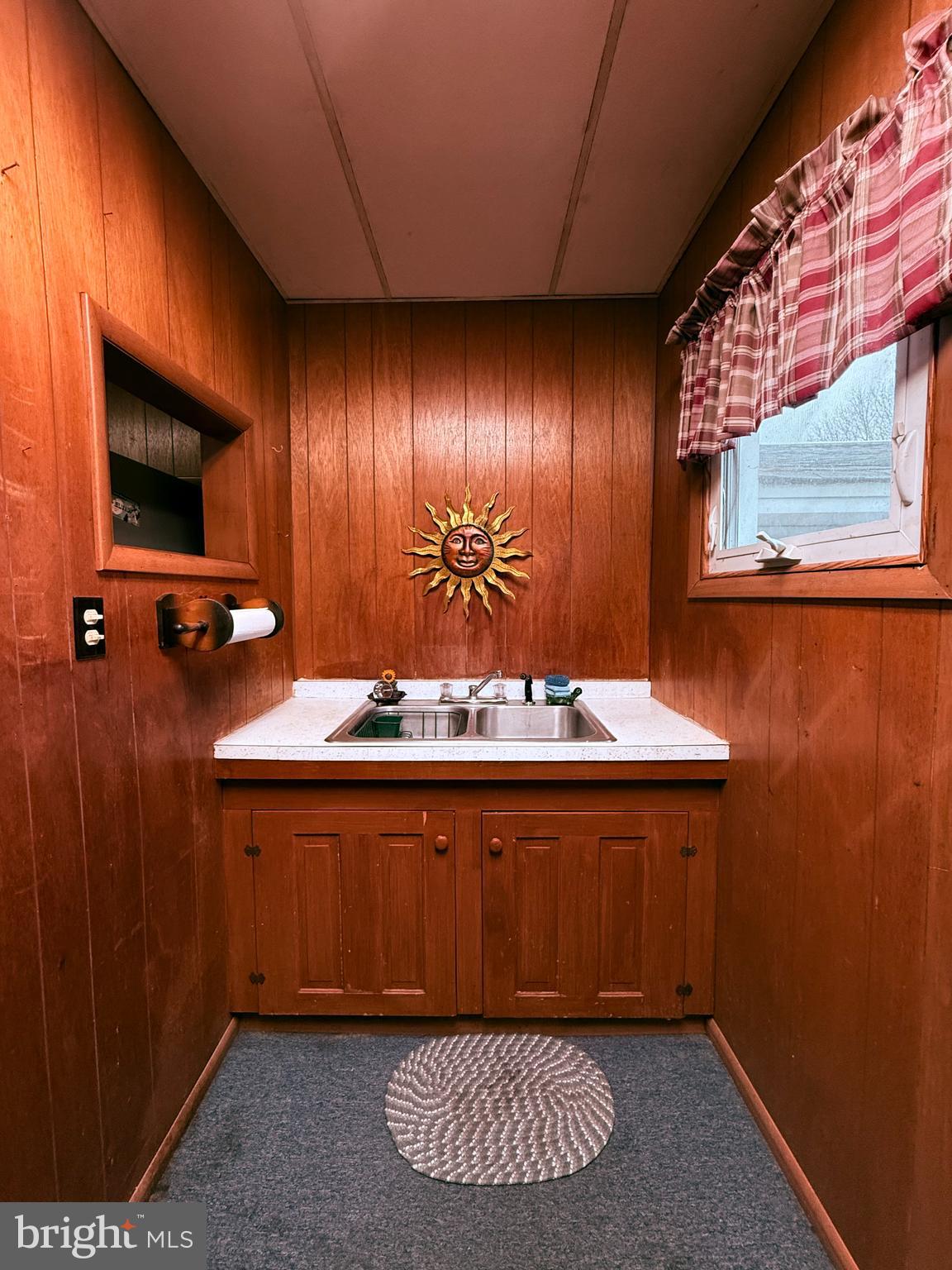 439 Bayard Street Kane, PA 16735 - Photo 12 of 22 a view of a bathroom with a sink and mirror