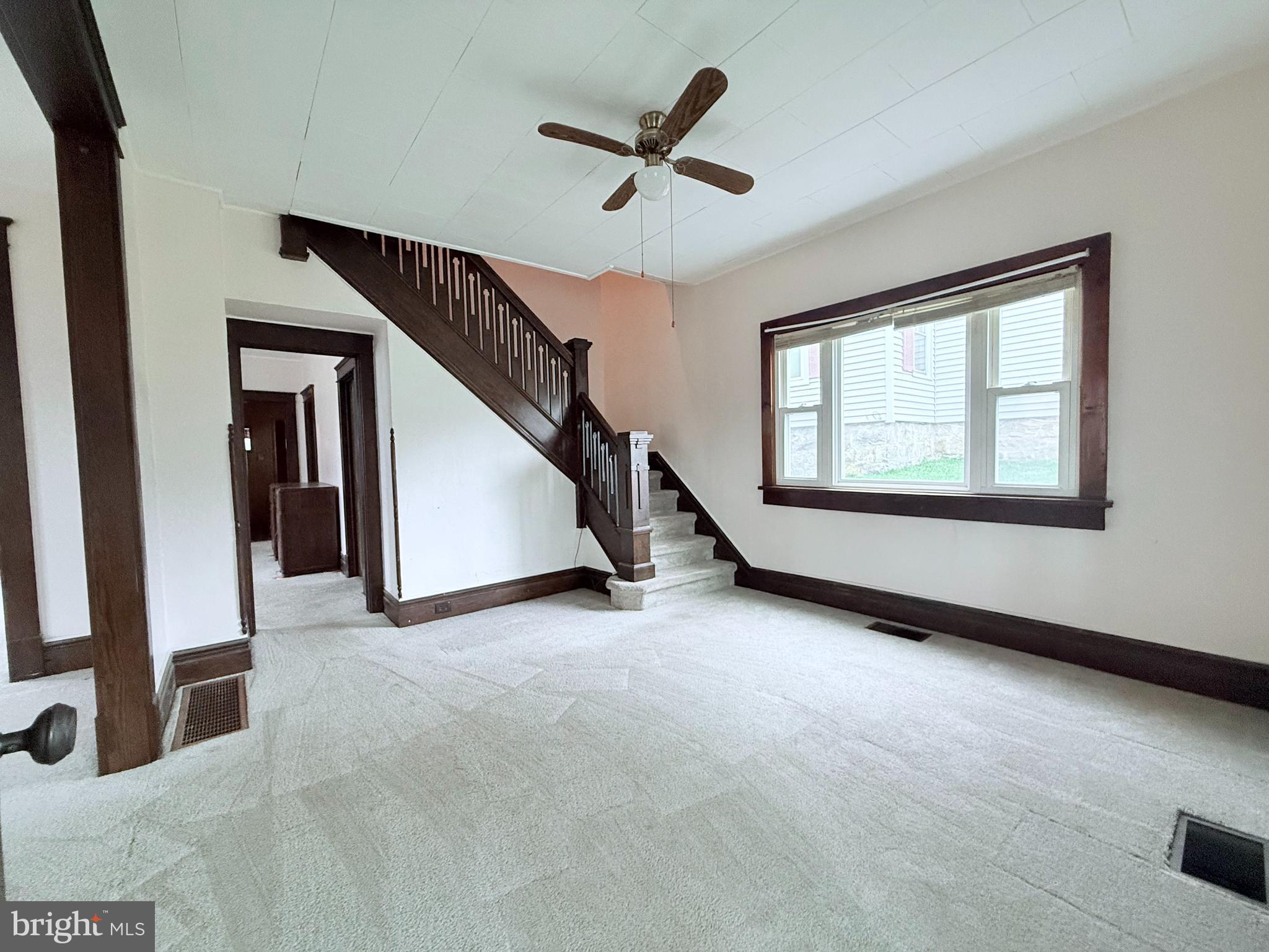 439 Bayard Street Kane, PA 16735 - Photo 5 of 22 a view of a livingroom with a ceiling fan and window