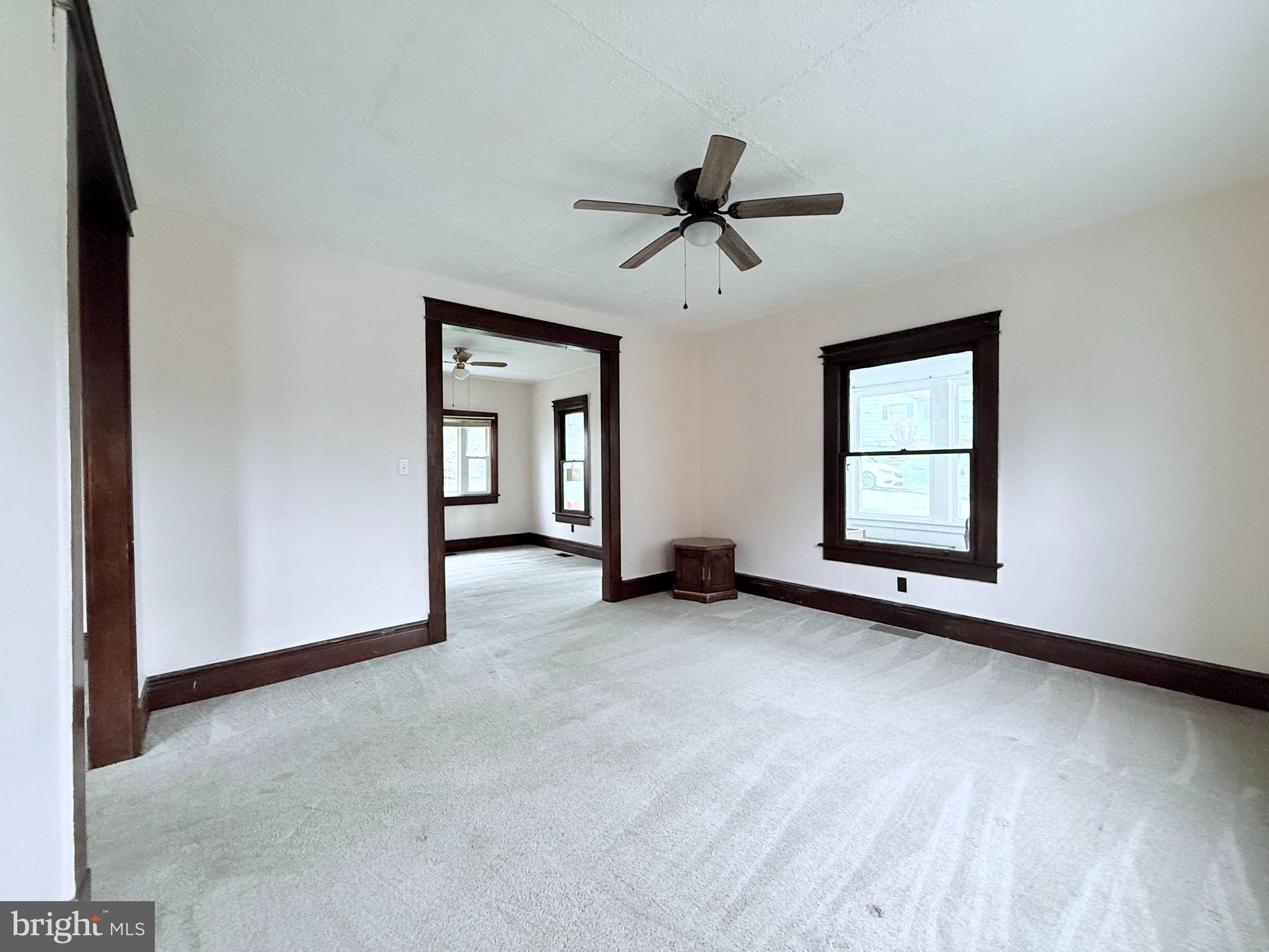 439 Bayard Street Kane, PA 16735 - Photo 7 of 22 a view of a livingroom with a ceiling fan and window