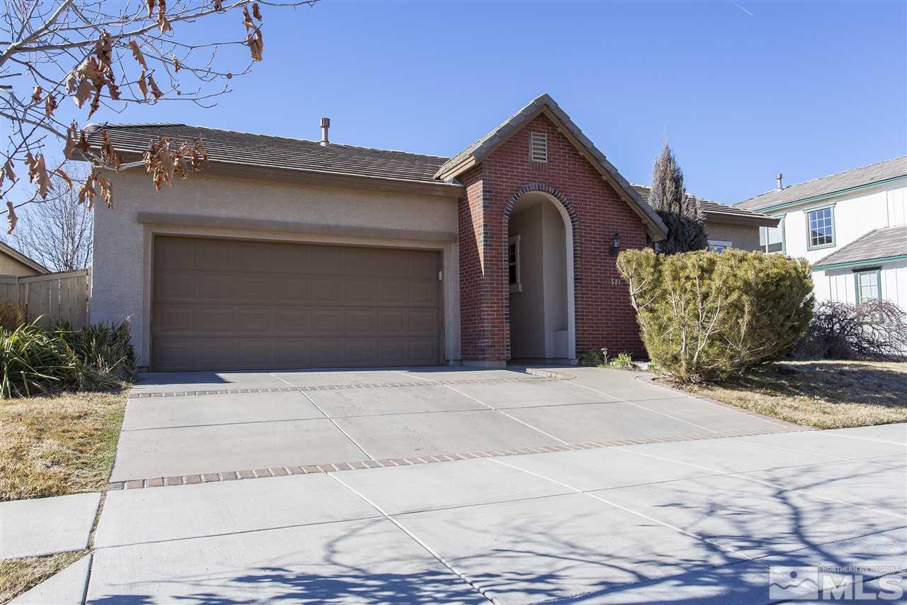 10521 Eagle Falls Way Reno, NV 89521 - Photo 1 of 1 a front view of a house with a yard and garage