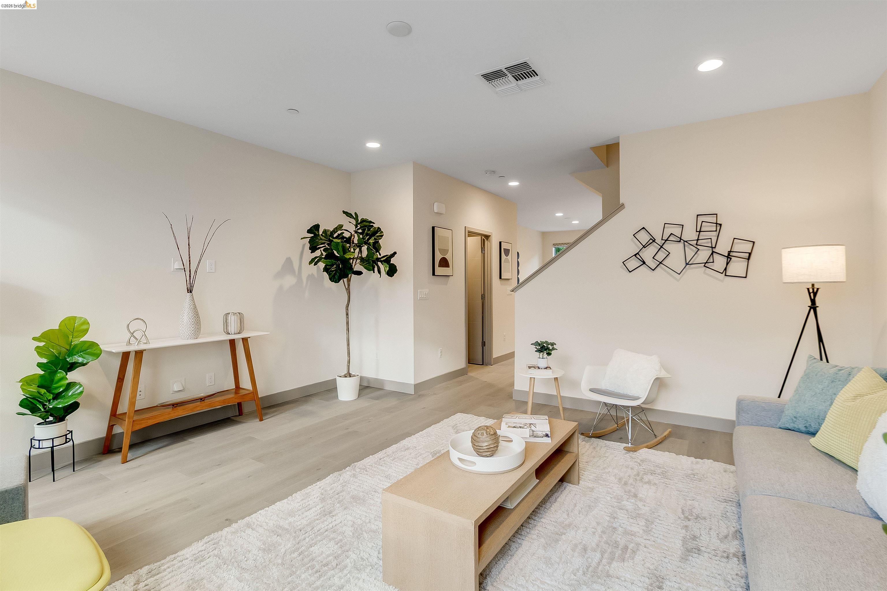 1357 Pullman Way Oakland, CA 94607 - Photo 19 of 37 Open concept living area featuring light wood-finish flooring and recessed lighting